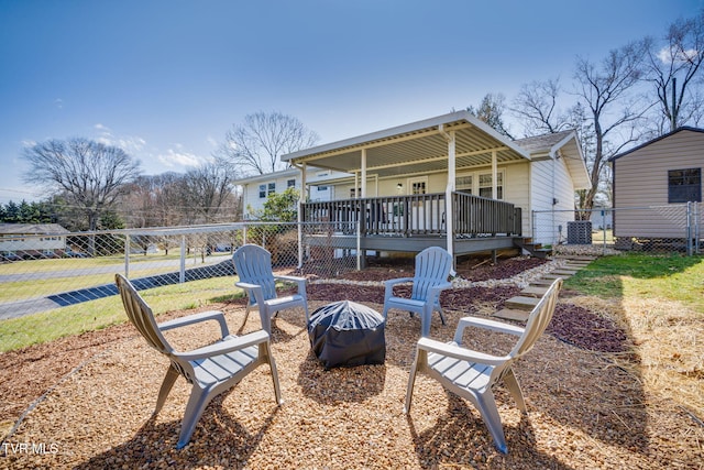 view of patio / terrace with an outdoor fire pit, covered porch, and fence