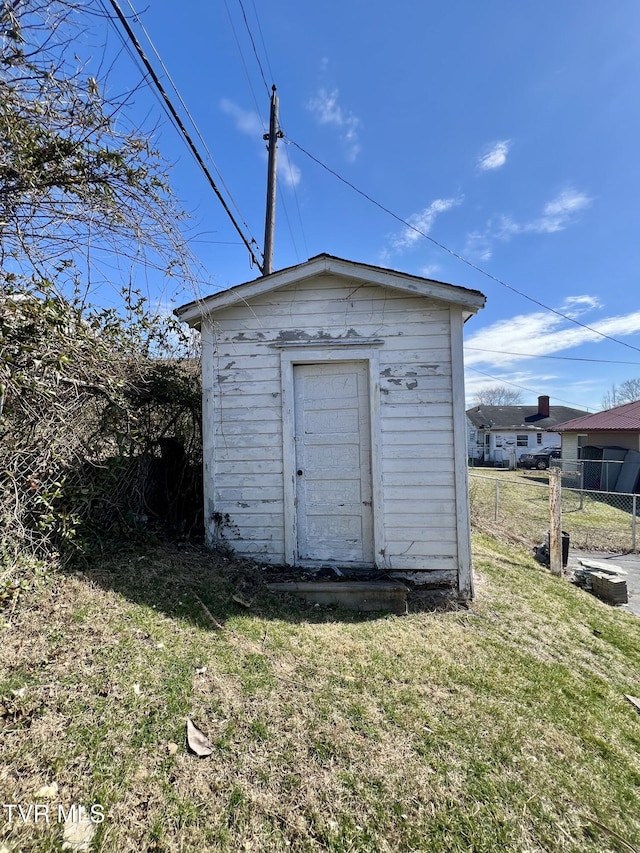 view of shed with fence