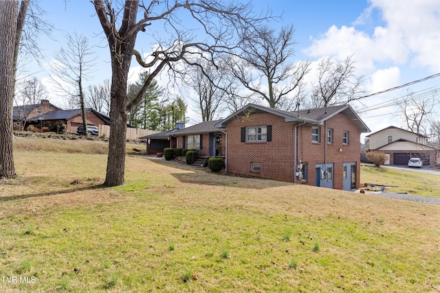 view of property exterior featuring a garage, a chimney, a lawn, and brick siding