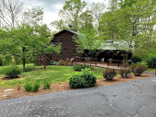 view of yard with a wooden deck