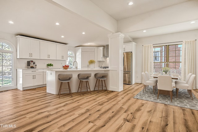 kitchen with freestanding refrigerator, recessed lighting, and light wood-style floors