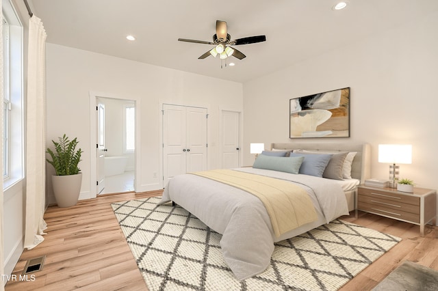bedroom featuring light wood-type flooring, visible vents, recessed lighting, connected bathroom, and baseboards