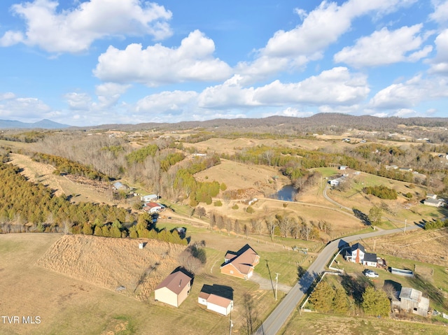 drone / aerial view featuring a mountain view and a rural view