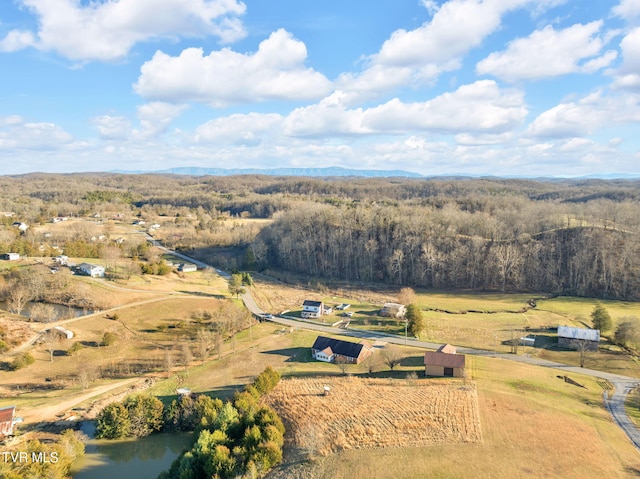 aerial view with a forest view, a rural view, and a mountain view