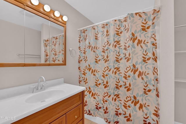 full bathroom with a shower with curtain and vanity