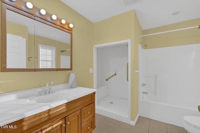 full bath featuring vanity, tile patterned flooring, and toilet