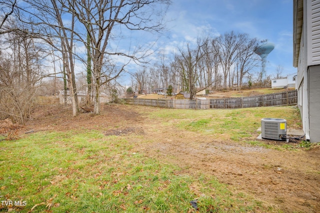 view of yard featuring cooling unit and fence