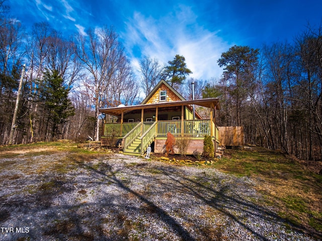 chalet / cabin with covered porch