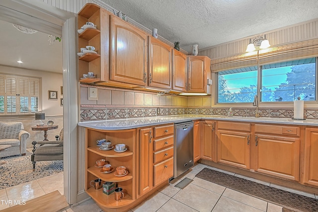 kitchen featuring light tile patterned floors, a textured ceiling, a sink, light countertops, and open shelves