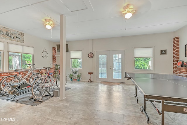 recreation room featuring french doors and attic access