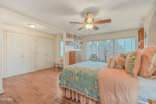 bedroom with ornamental molding, ceiling fan, and light wood finished floors