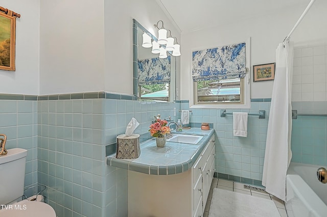 bathroom featuring toilet, vanity, tile walls, tile patterned floors, and shower / bath combination with curtain