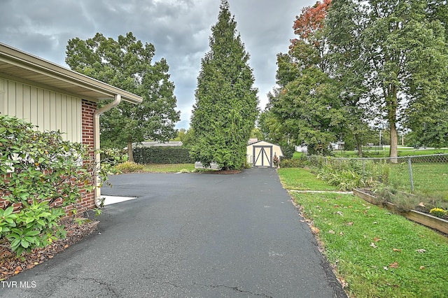 view of street with aphalt driveway