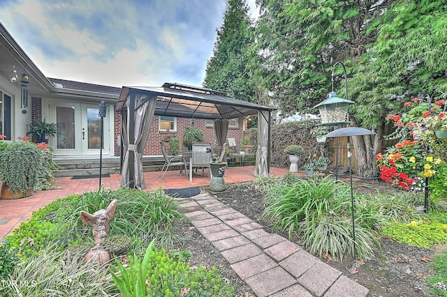 exterior space with a gazebo, french doors, and a patio