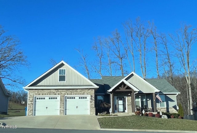 craftsman inspired home with board and batten siding, concrete driveway, roof with shingles, and a garage