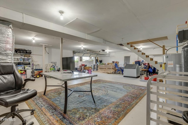 game room featuring concrete flooring and electric water heater