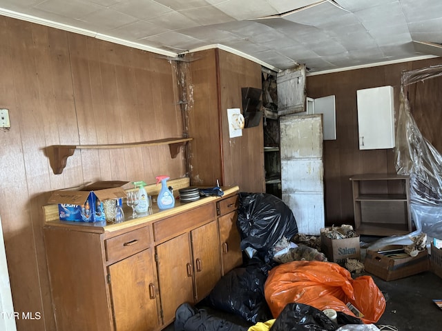 kitchen with wood walls and brown cabinetry