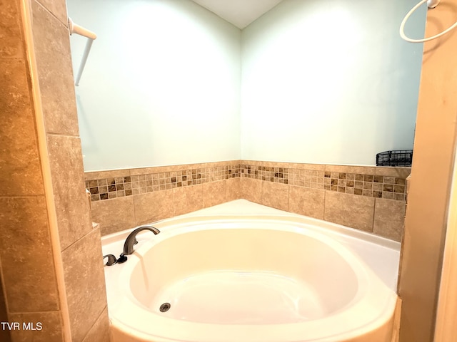 bathroom with a garden tub