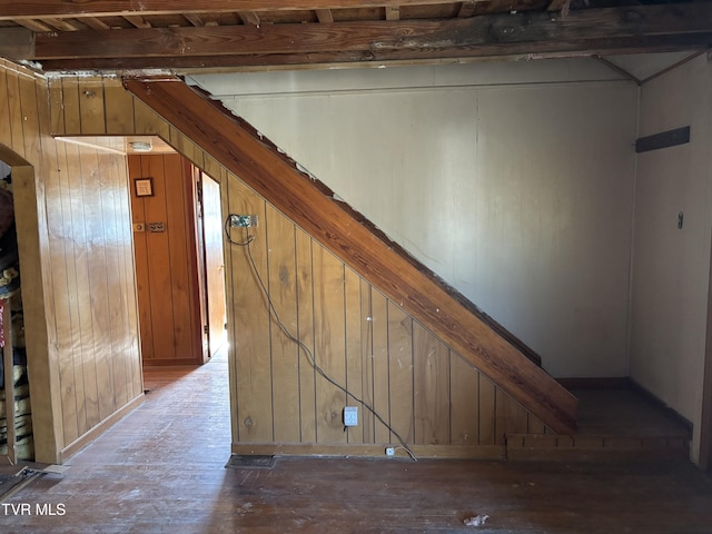 interior space featuring wooden walls