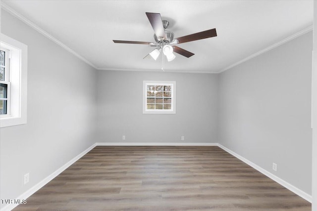 unfurnished room with ornamental molding, ceiling fan, baseboards, and wood finished floors