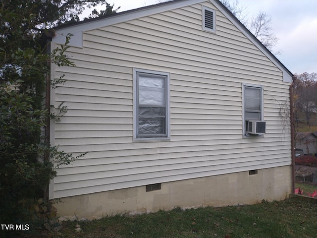 view of property exterior with cooling unit and crawl space