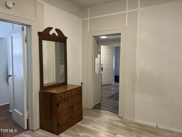 hallway featuring light wood-style flooring