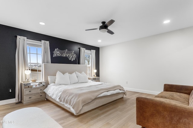 bedroom featuring light wood-style floors, multiple windows, baseboards, and recessed lighting