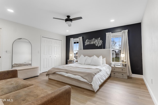 bedroom featuring baseboards, ceiling fan, light wood-type flooring, a closet, and recessed lighting