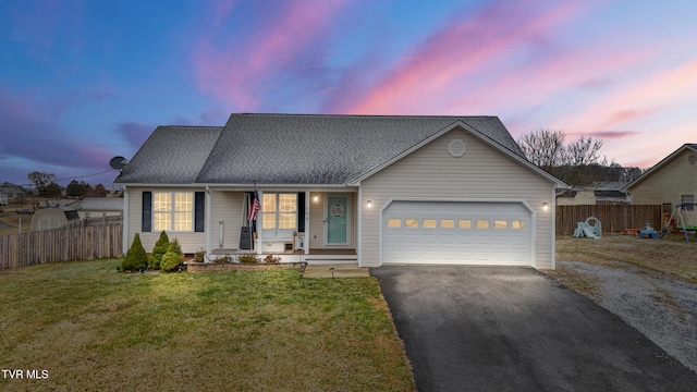 view of front of home featuring driveway, an attached garage, fence, and a yard