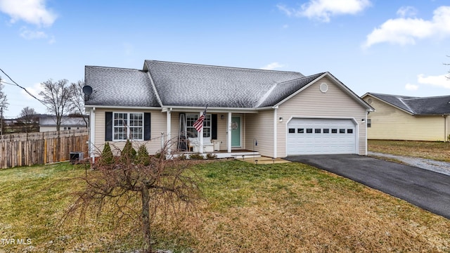 view of front facade featuring aphalt driveway, a porch, a garage, fence, and a front lawn