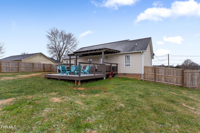 rear view of house with a deck, a yard, crawl space, and a fenced backyard