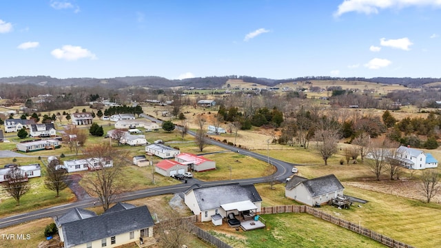 birds eye view of property with a rural view