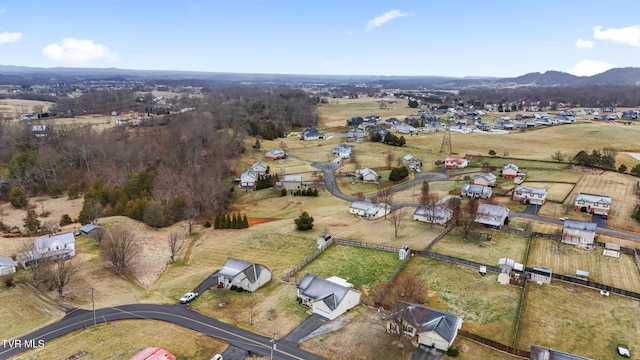 birds eye view of property with a rural view and a mountain view