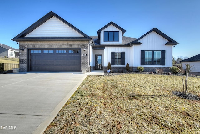 modern inspired farmhouse with concrete driveway, brick siding, a garage, and a front lawn