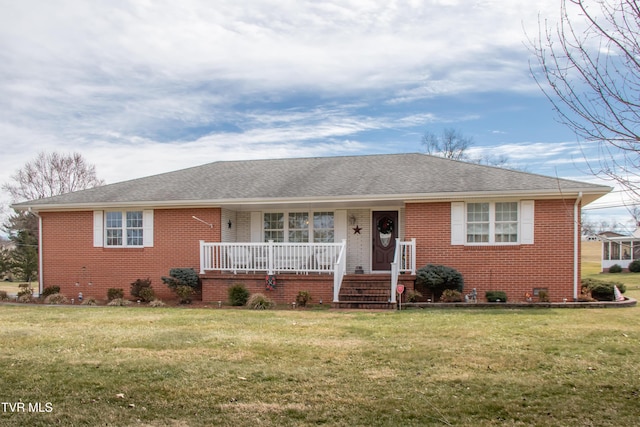 ranch-style house with a porch, a front lawn, and brick siding