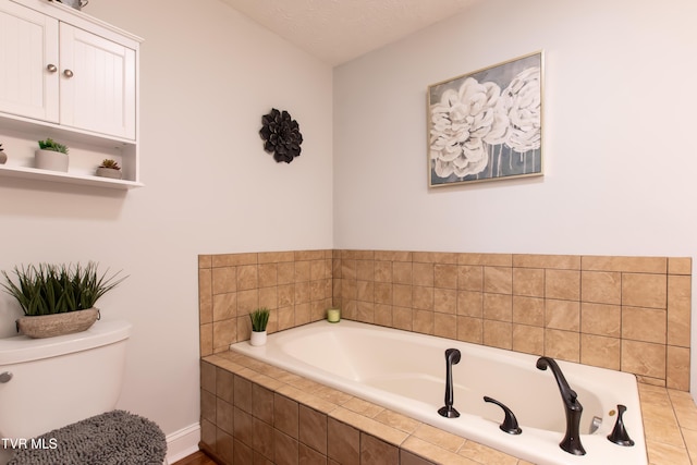 bathroom featuring toilet and a bath