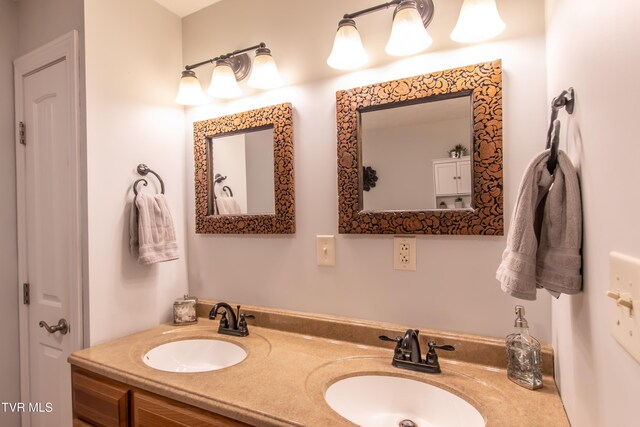 bathroom featuring double vanity and a sink