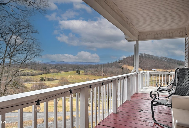 wooden terrace featuring a mountain view