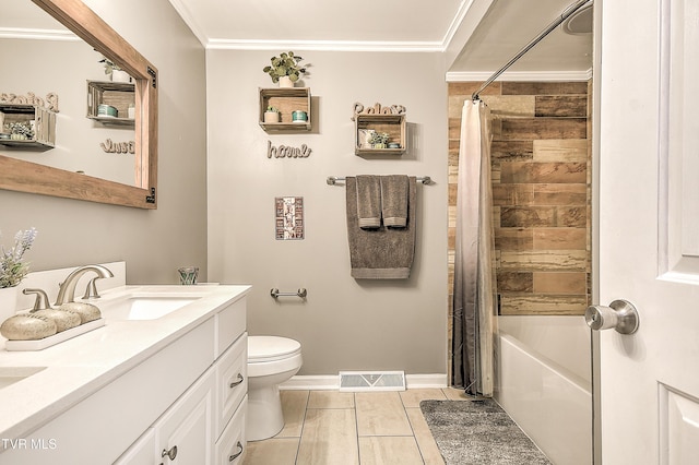 bathroom with toilet, a sink, visible vents, ornamental molding, and double vanity