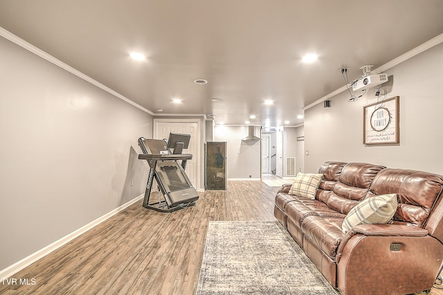 living area with ornamental molding, recessed lighting, wood finished floors, and baseboards