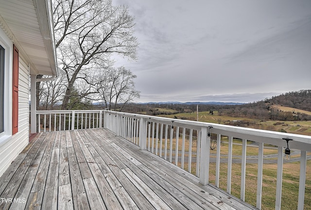 wooden deck with a mountain view