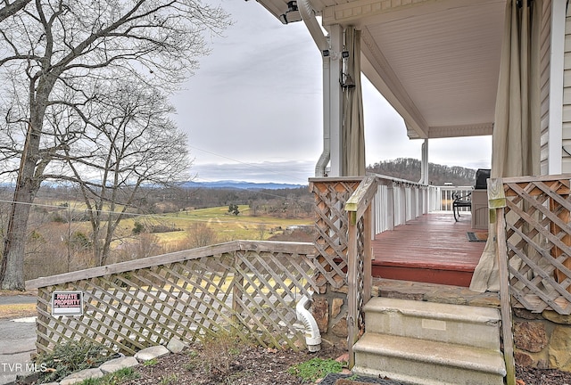 wooden terrace with a mountain view