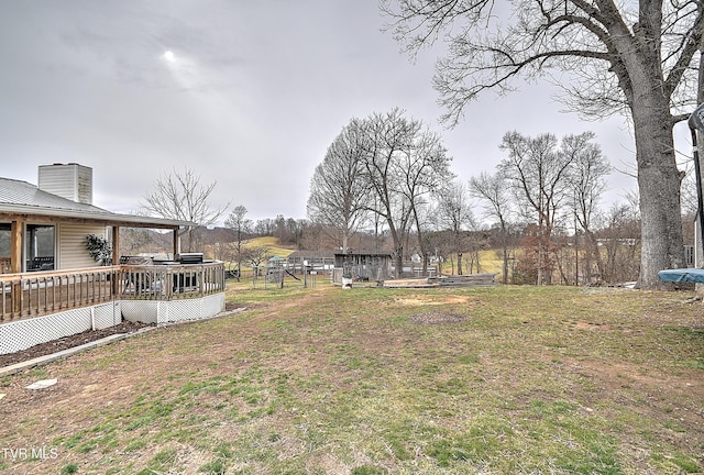 view of yard with a wooden deck