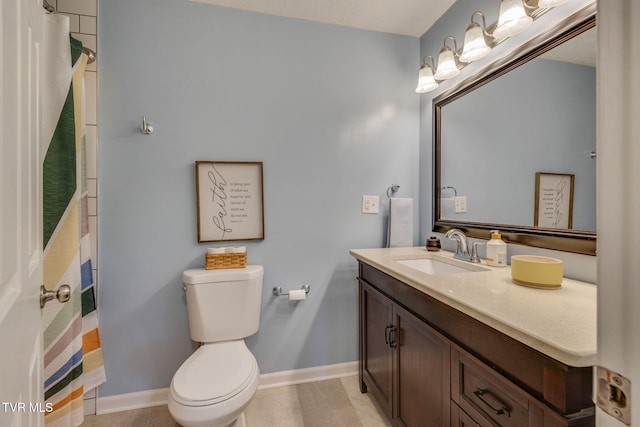 full bath featuring curtained shower, vanity, toilet, and baseboards