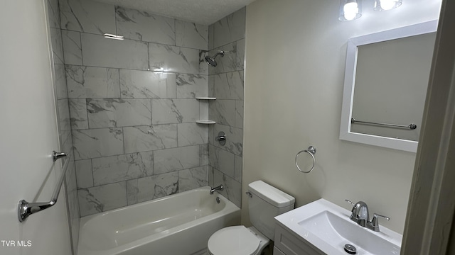 bathroom featuring washtub / shower combination, vanity, and toilet