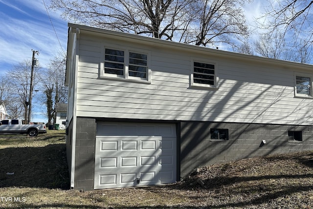 view of property exterior featuring a garage