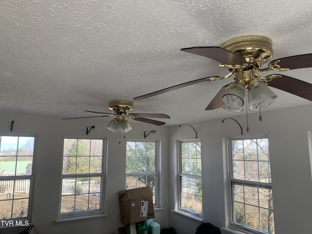 room details featuring a textured ceiling and a ceiling fan