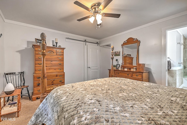 carpeted bedroom with a barn door, ornamental molding, and a ceiling fan