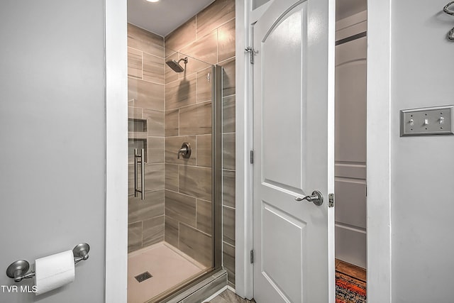 bathroom with a shower stall