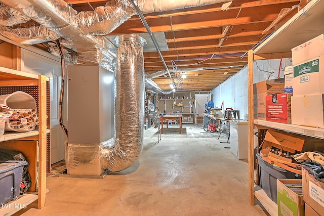 unfinished basement featuring a workshop area